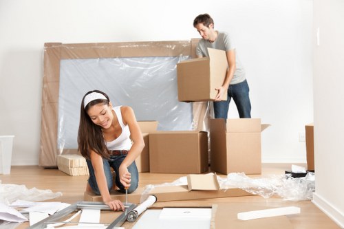 Removal van and moving crew handling a Poplar apartment move
