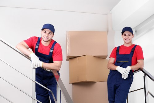 Mover handling furniture carefully during transport and delivery