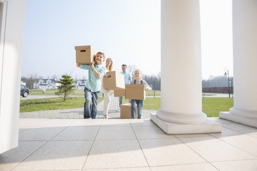Same day removals team transporting household items in Poplar