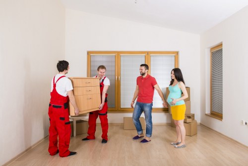 Professional movers handling a business relocation in Poplar