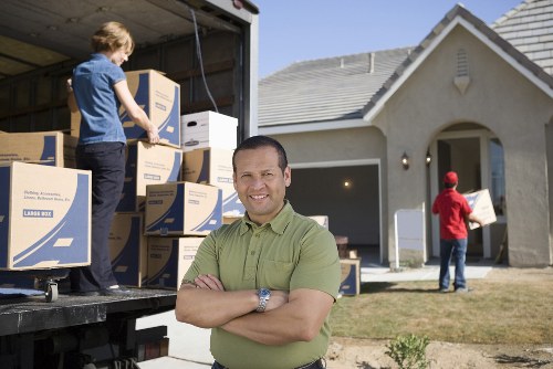 Furniture removal team handling bulky household items in Poplar