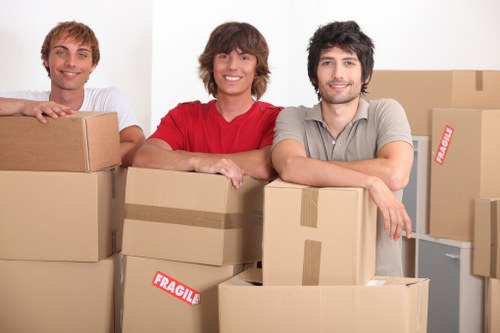 Office relocation team planning a commercial move in Poplar with labelled packing supplies