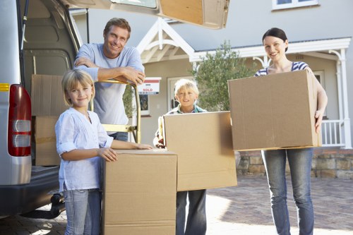 Packed moving boxes prepared for removals in Poplar apartment
