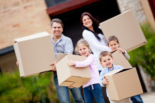 Professional movers handling furniture during a Poplar move