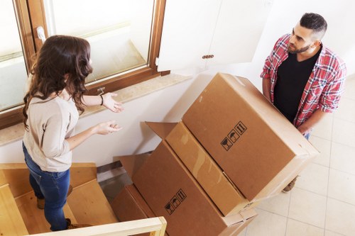 Office furniture removals in Poplar with desks and chairs prepared for relocation
