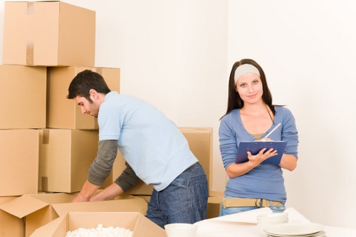 Furniture being carefully loaded by house removalists in Poplar
