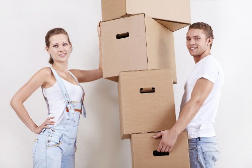Careful wrapping of fragile household items during a Poplar move