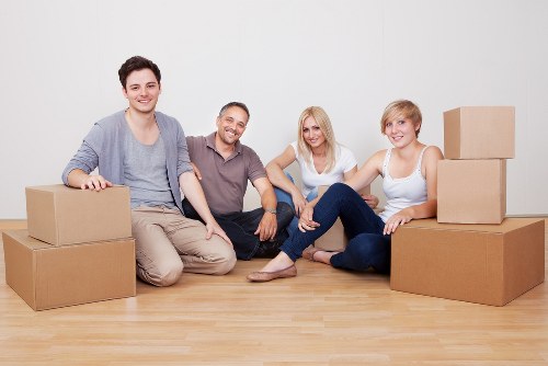 Furniture being carried down stairs during a Poplar move