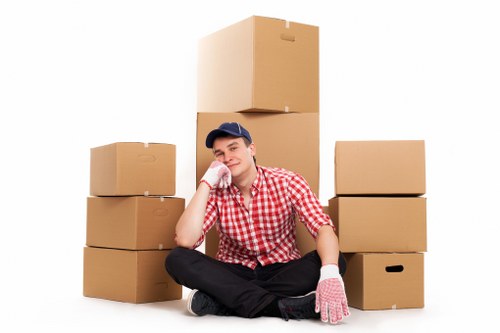 Business relocation preparation with labelled boxes and office equipment