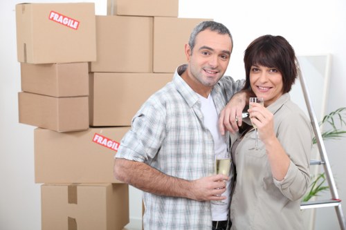 Professional movers packing household items safely